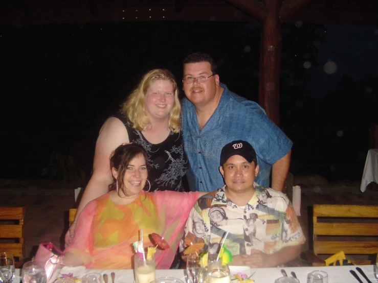 a group of people sitting at a table