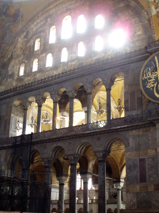 the inside of a building with arched windows and large arches