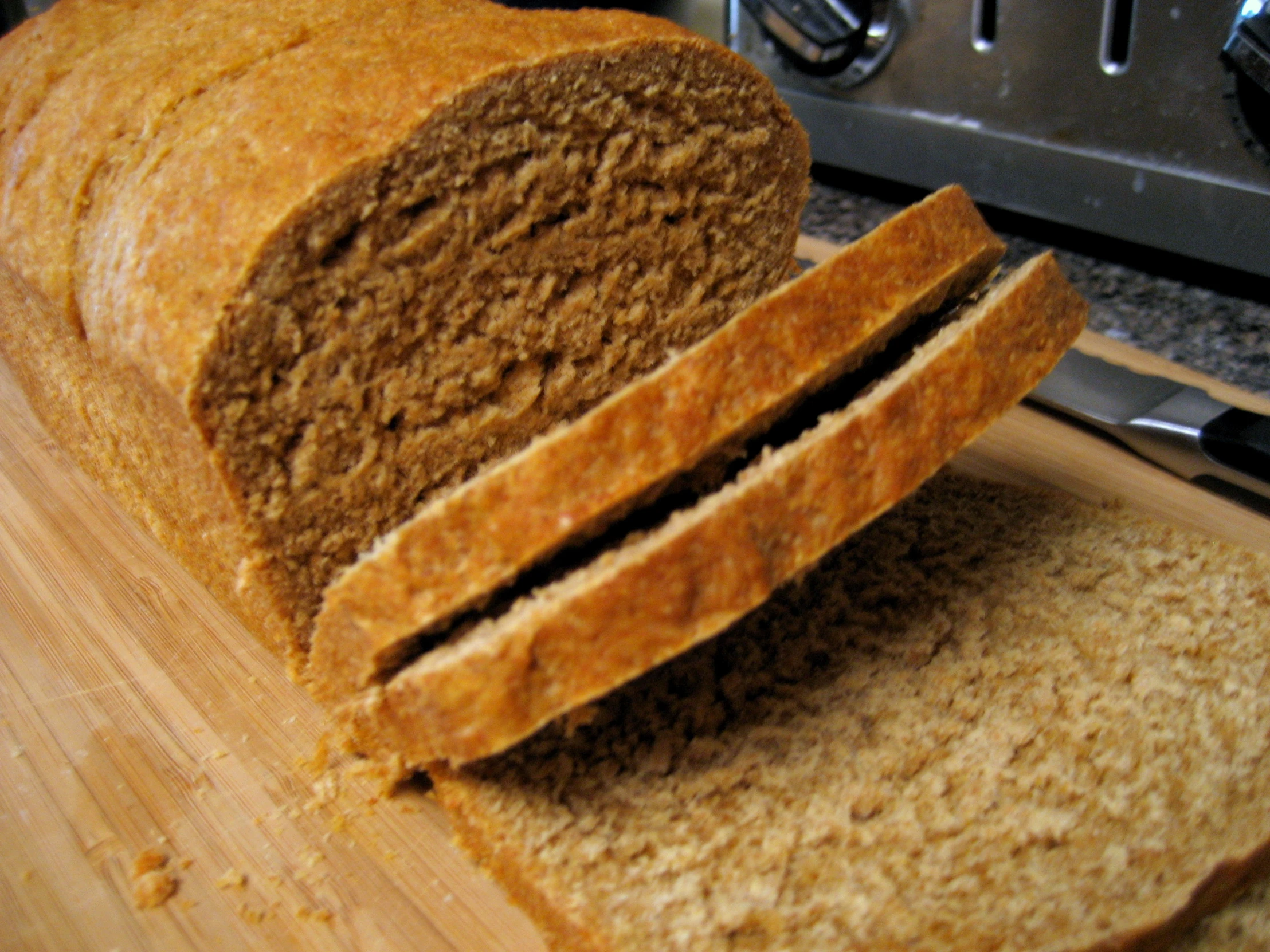 sliced loaf of bread sitting on a  board