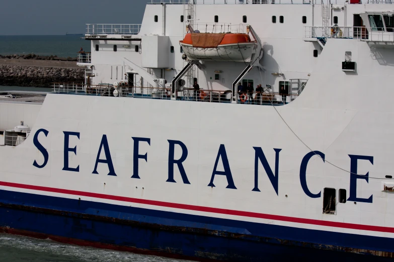 a boat sitting docked in the ocean with the name seafrance