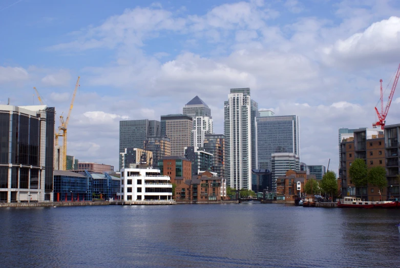 large buildings line the shoreline in an otherwise cloudy setting