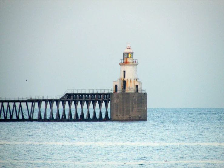 a light house in the middle of the ocean