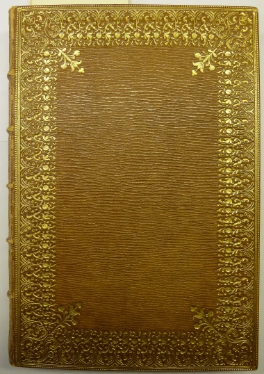 an open gold square shaped pattern on a white wall