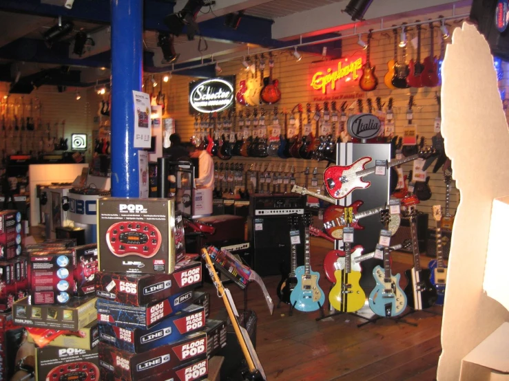 a guitar store displays guitars, amps and guitars