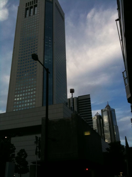 the view of a very tall building from across the street