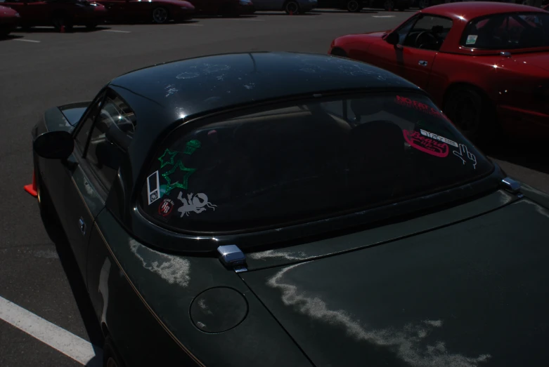 a car sitting in the lot with a sign on it