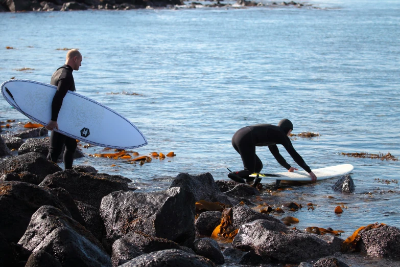 two surfers waiting for the waves at the beach