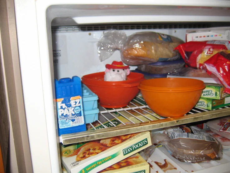 an open refrigerator door containing various food items