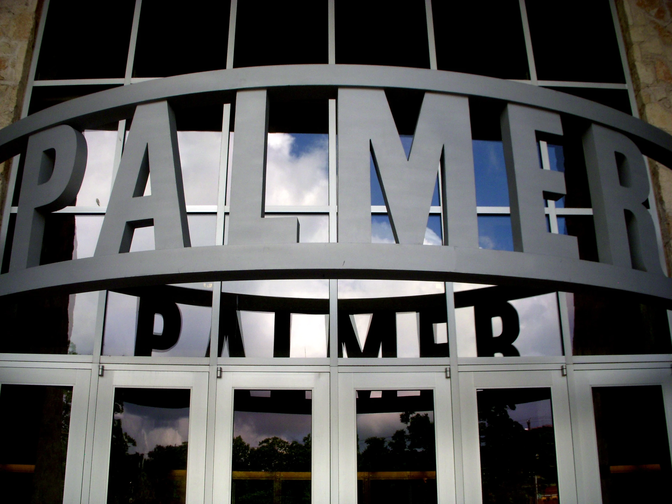 the entrance to a building that has a metal entrance