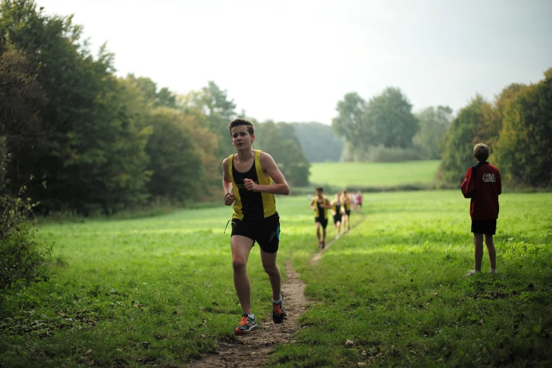 a group of people running in the forest