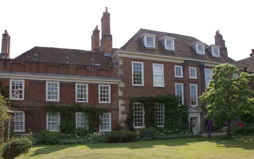 an ornate brick house with two rows of windows