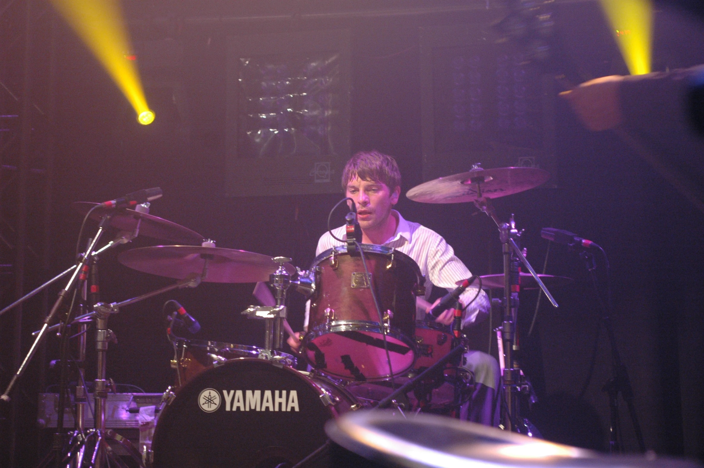 a man playing drums at a concert