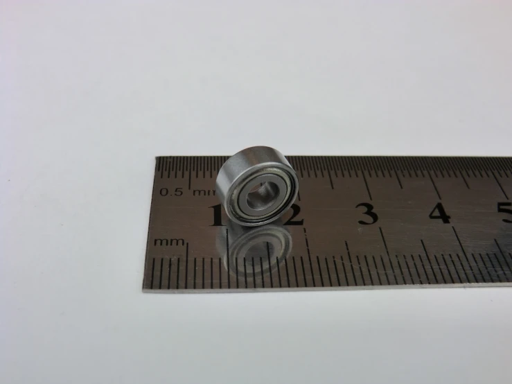 an measuring ruler with the end of a metal on
