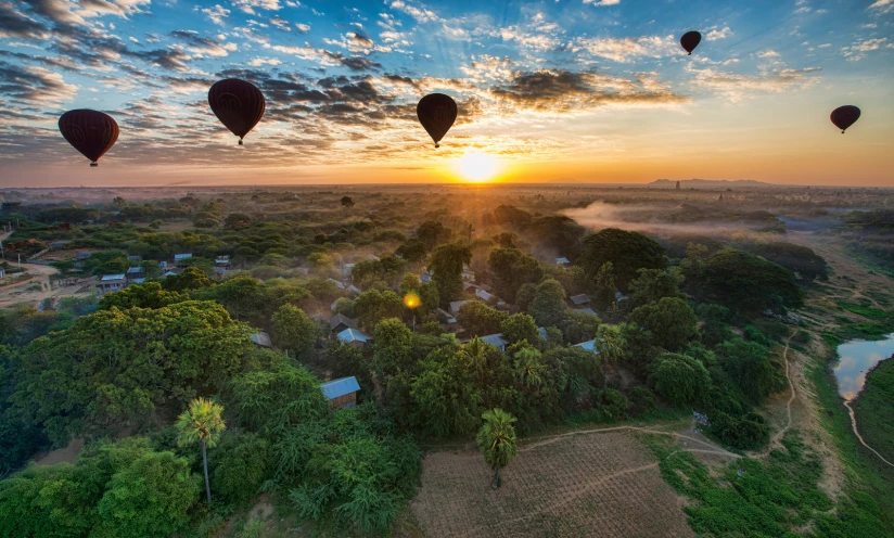  air balloons flying high up in the sky