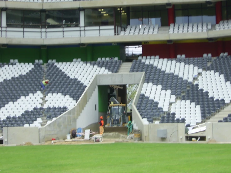 empty seats are being setup in an outdoor stadium