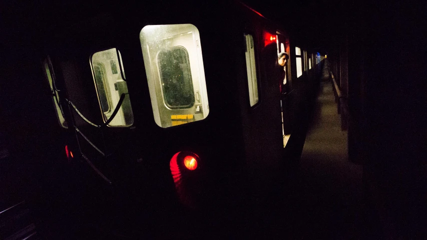 a train traveling along tracks at night