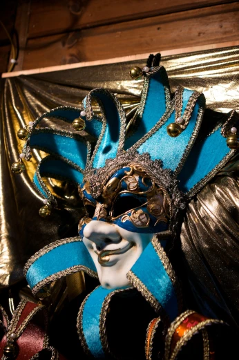 a blue mask and beads next to a mirror