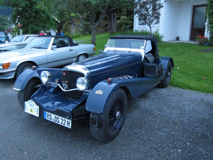 this is an old model car parked in the lot