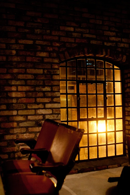 a small chair sitting in front of a window