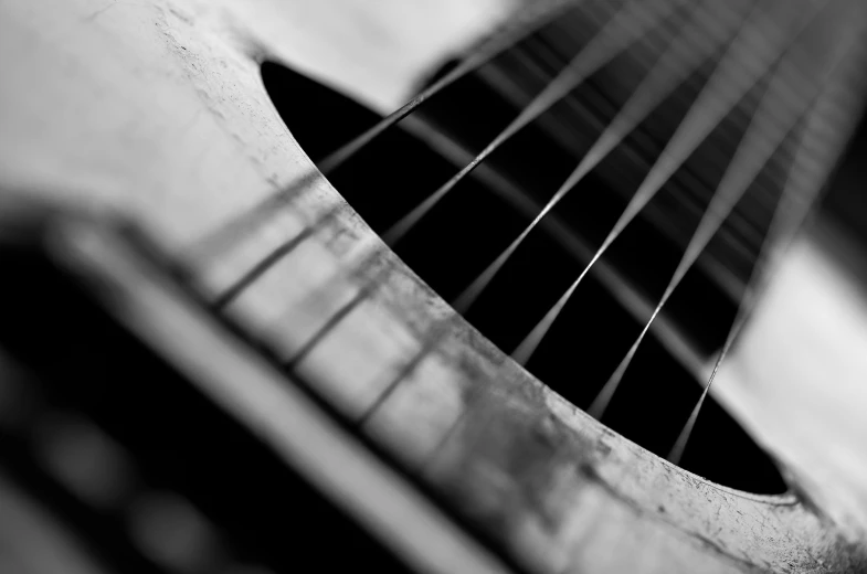 a guitar head with a black and white po