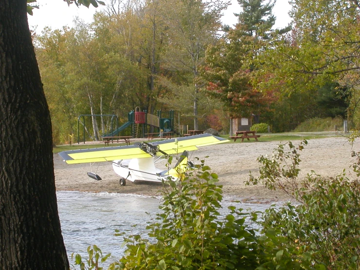 a seaplane is parked in a shallow lagoon