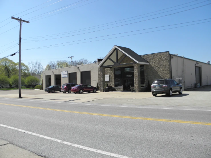 cars are parked in front of the storage building