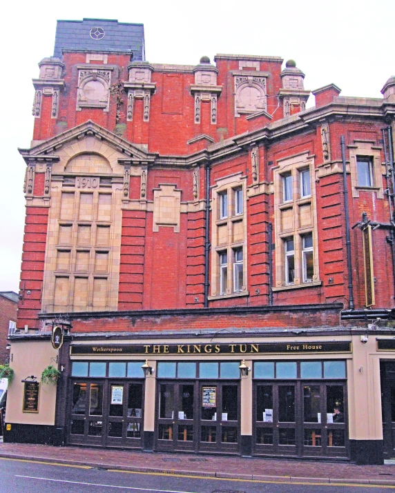 this is an old, two story, red brick building