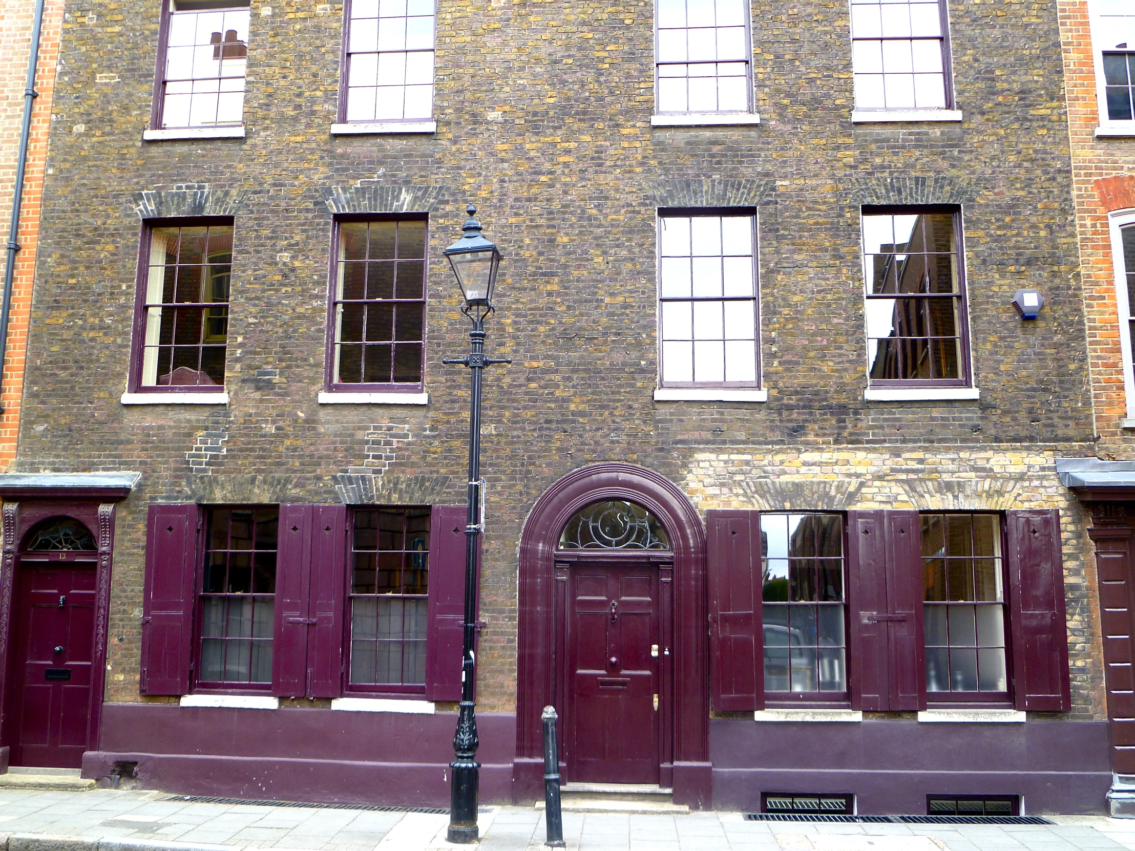 an old brick building that has many windows