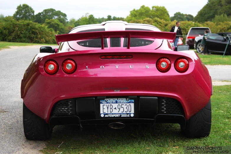 the rear end of a red sports car