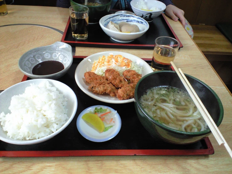 a table with three bowls of various foods on it