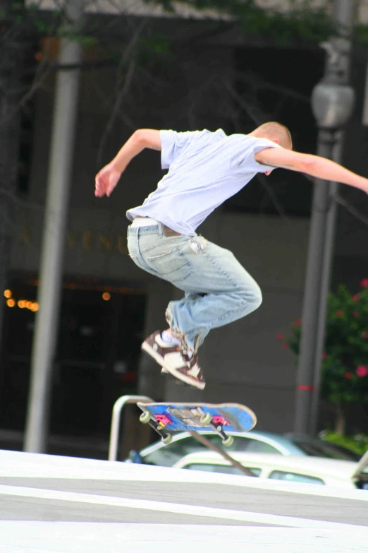 a young person on a skateboard jumps high in the air