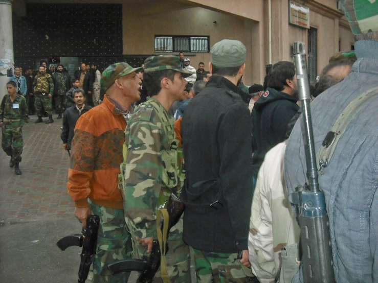 there are two soldiers standing in front of the crowd