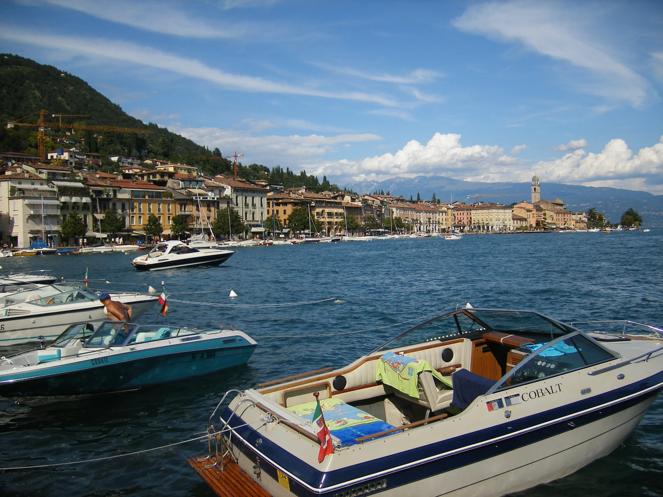 boats docked in the harbor of a small village