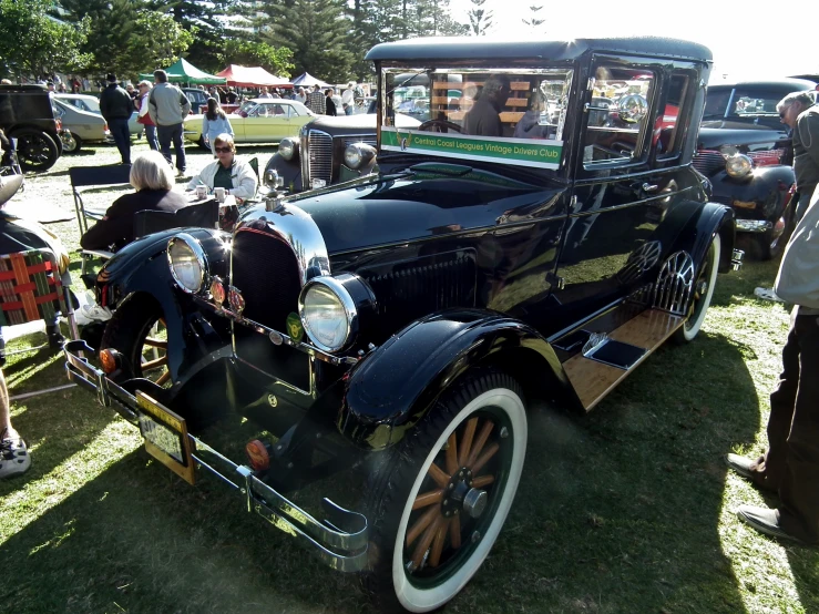 an antique car on display at an event