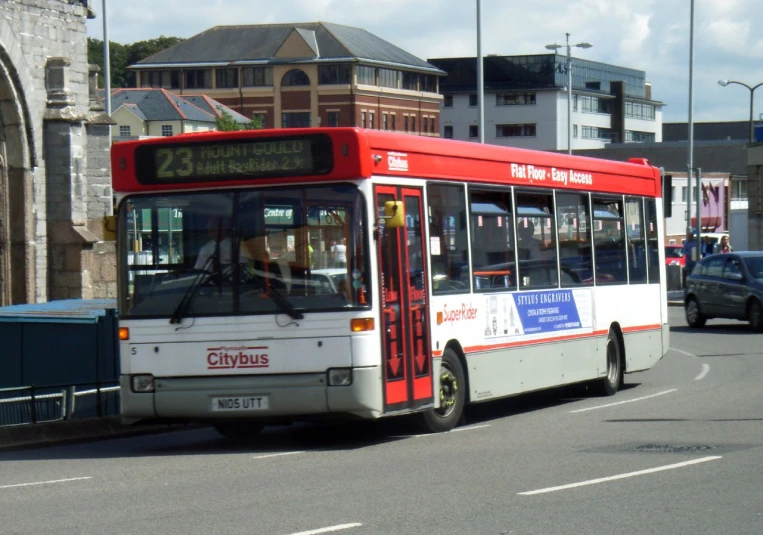 the passenger bus is going through the city