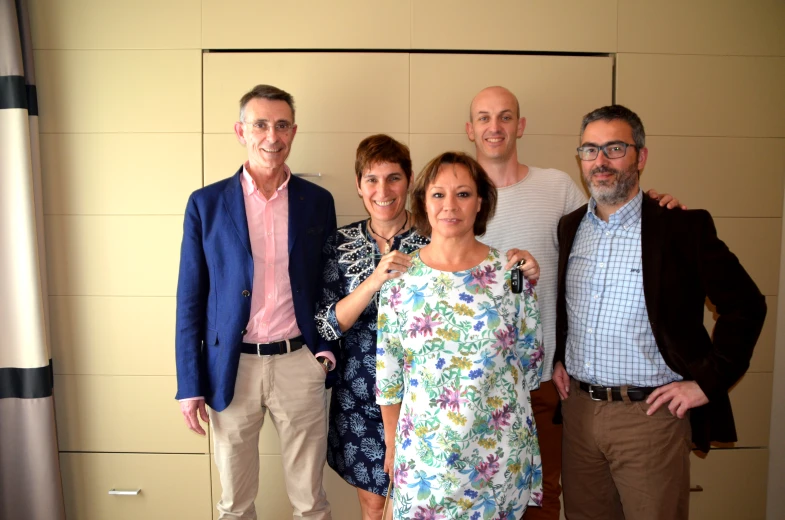 a group of people with glasses posing for a po