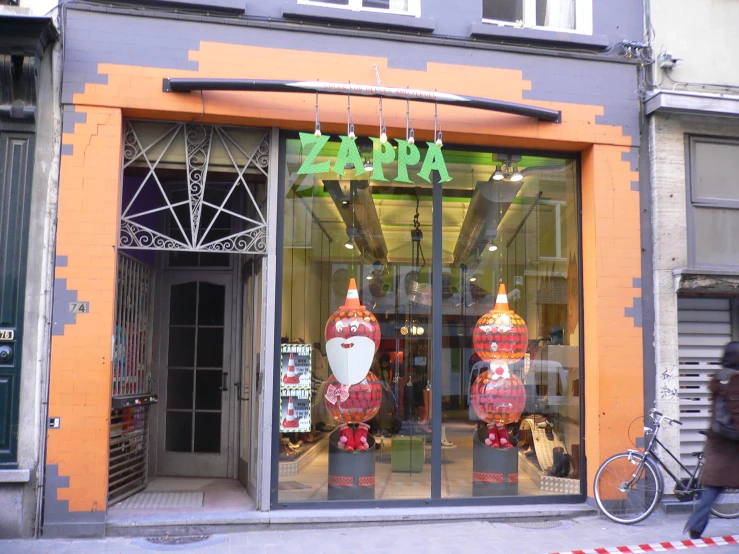 a storefront decorated with christmas decorations on a street corner