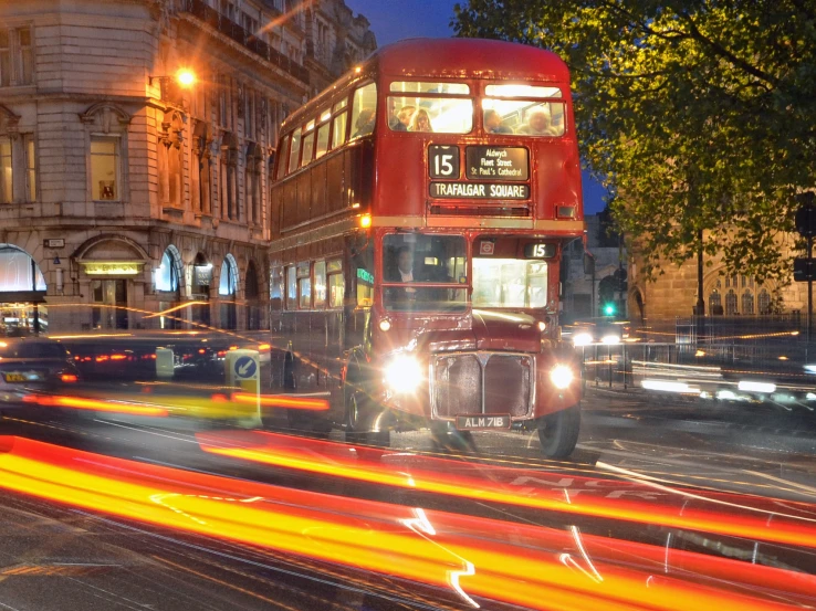 traffic going through an intersection at night in london