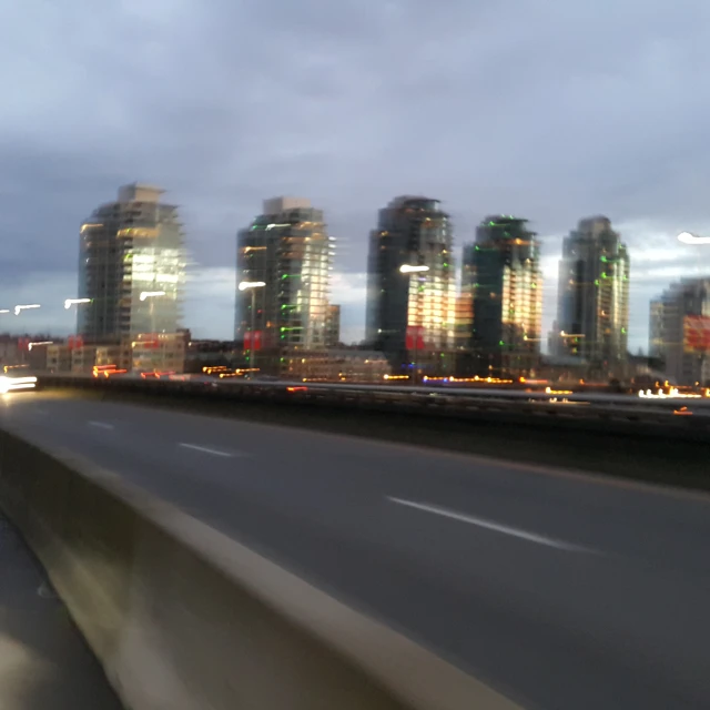 the large city skyline is lit up for night time