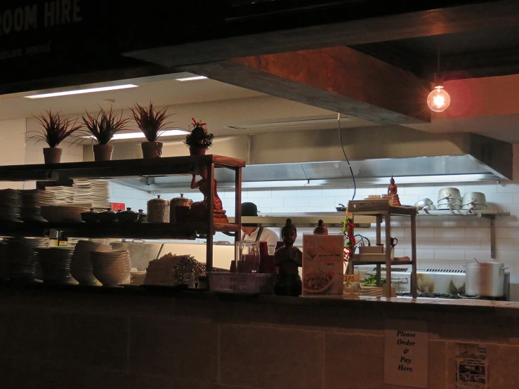 a kitchen filled with lots of pots and pans