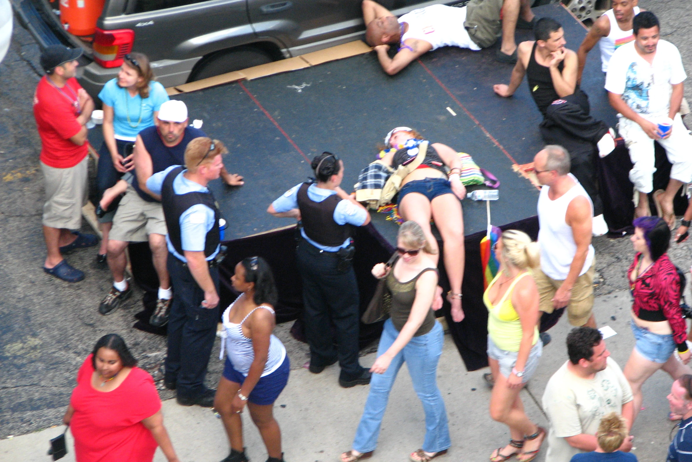 an image of several people walking around on the street