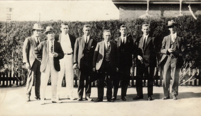 the old picture shows an old group of men in suits