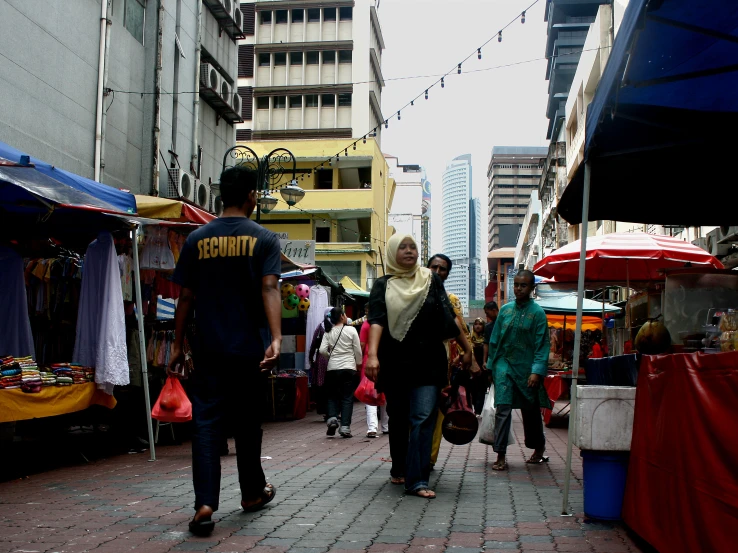 the people are walking around on the city street