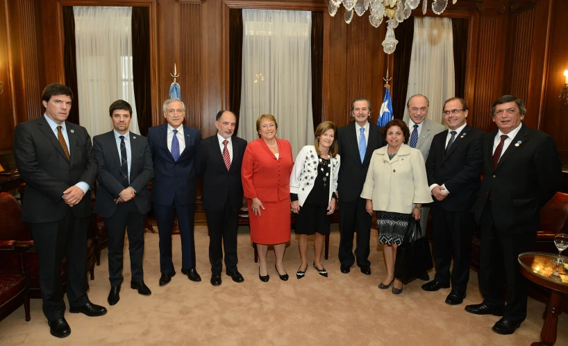 a group of business people posing in suits and ties