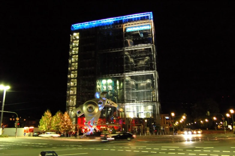 large building with glass and lights on it