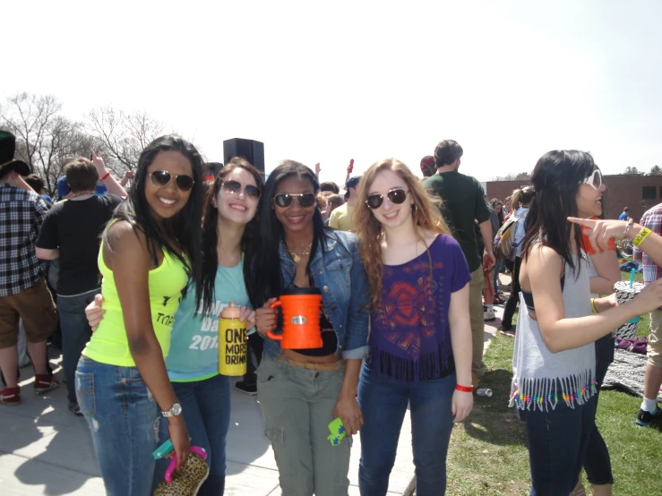 a group of young women standing next to each other