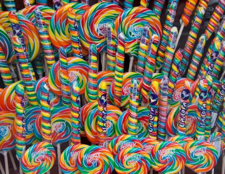 several lollipops of all colors and shapes, all being held together