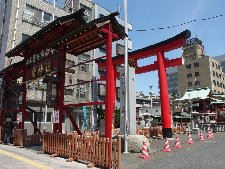 a red structure is seen on the corner of this street