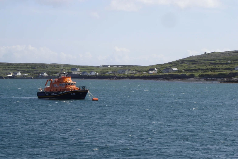 a large boat is in the middle of a body of water