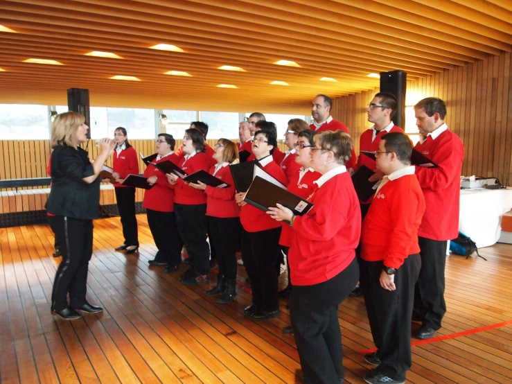 a choir of young men and women performing